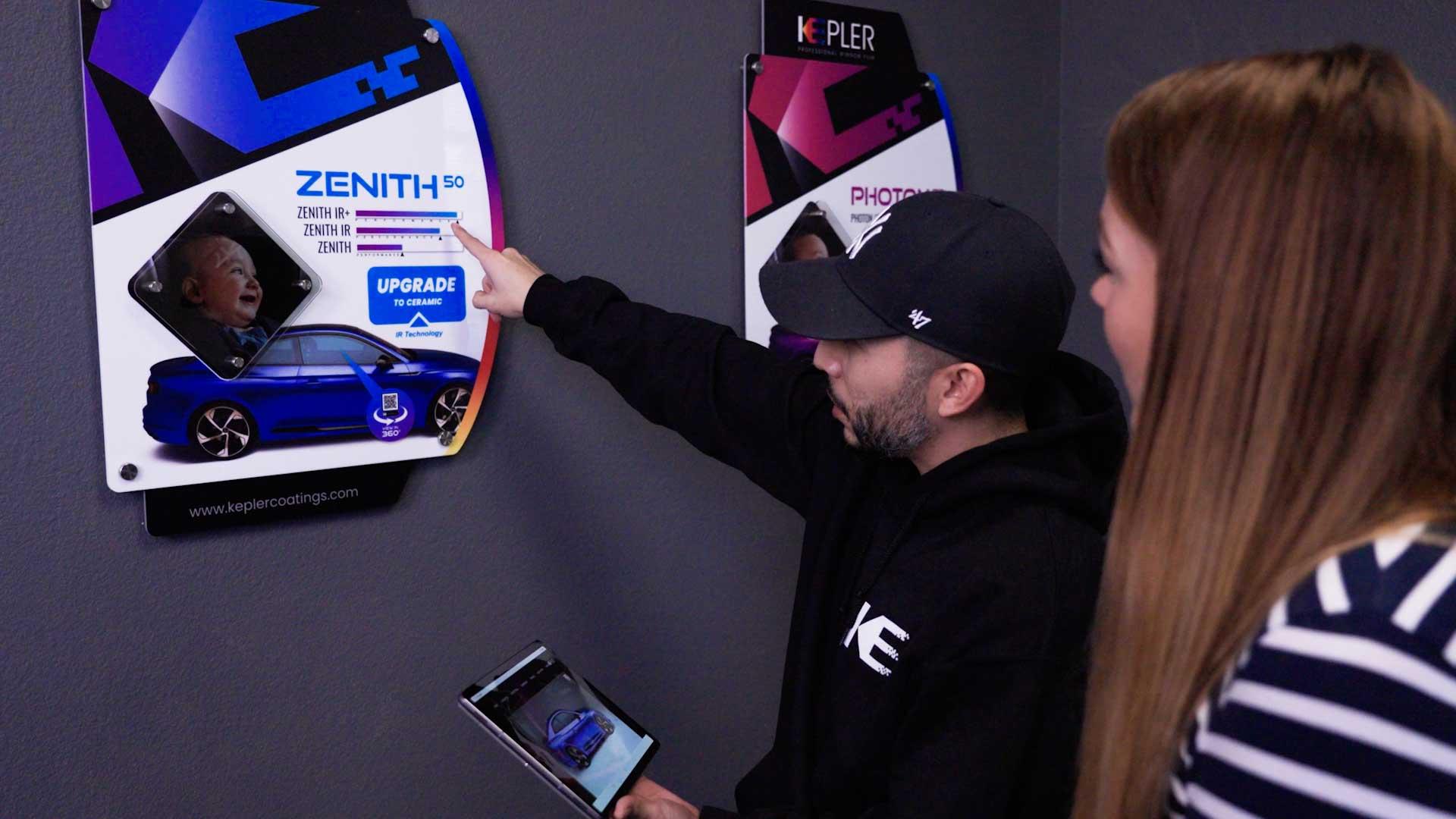 Kepler installer explaining automotive window film options to a customer