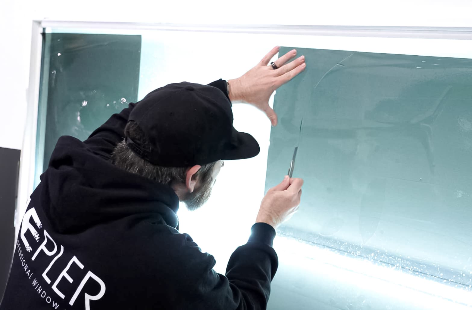 Ceramic window tint preparation on a premium vehicle